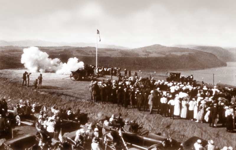 Antique image of a cannon being fired outside the Vista House, to commemorate its opening.